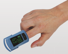 Load image into Gallery viewer, Riester ri-fox N pulse oximeter showing finger inserted and taking readings of SpO2 and pulse rate
